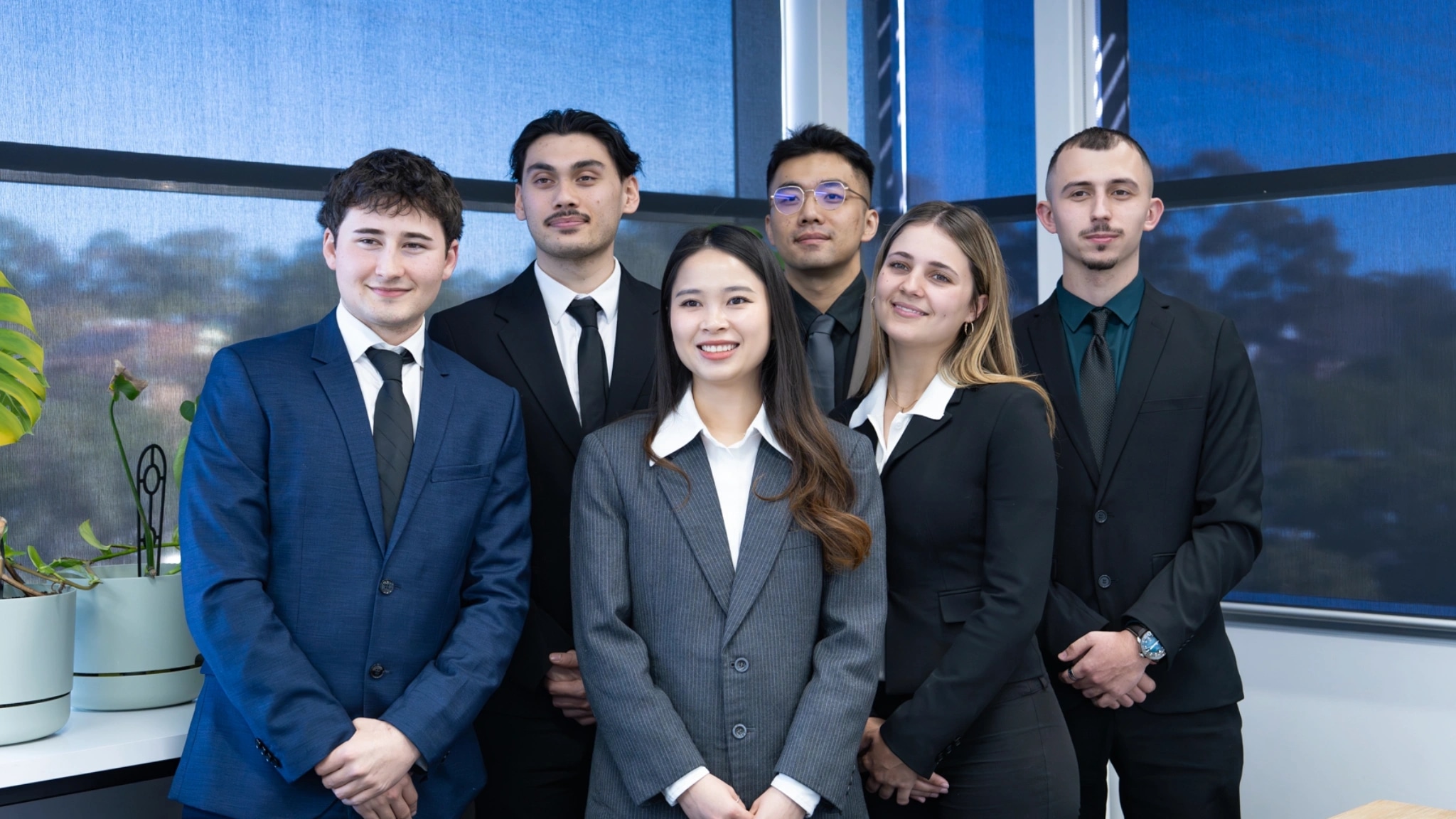 The Valato valuations team standing together in their Sydney office